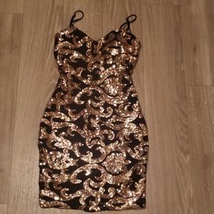 Black and gold sparkly, cocktail dress.